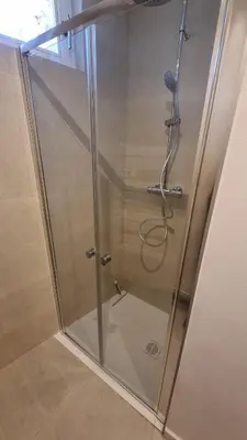 a shower with a glass door in a bathroom at En plein coeur de Pélissanne - 55 m2 rénovés - Avec Parking in Pélissanne