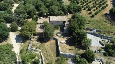 an aerial view of a house with trees at Le Jas des aiguiers in Saint-Saturnin-les-Apt