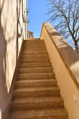 a set of stairs leading up to a building at L'Atelier Appartement au cœur du vignoble in Rognes