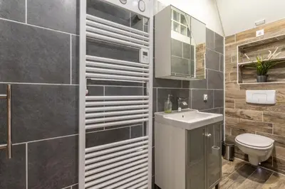 a bathroom with a toilet and a sink at Studio Cardeurs in Aix-en-Provence