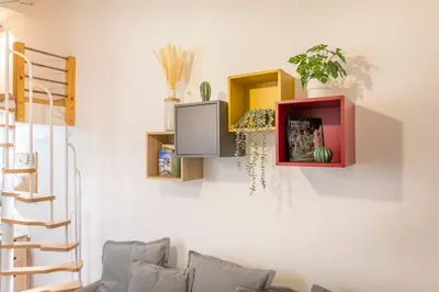 a living room with a tv on a wall at Studio Cardeurs in Aix-en-Provence