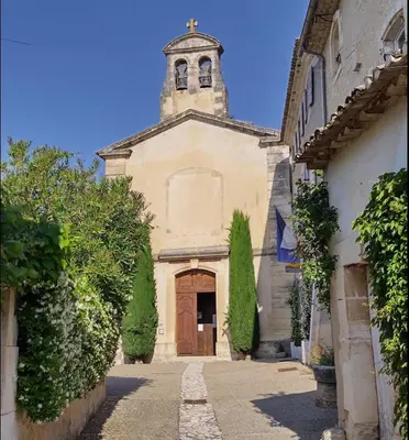 a church with a clock tower on top of it at Magic views in paradise in Joucas
