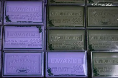 a group of boxes of lavender candles in a wall at Gîte Les Hauts Sauviers avec piscine et sauna in Bédoin