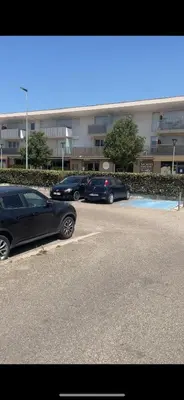 a row of parked cars parked in a parking lot at Appartement Studio en résidence Avignon zone Agroparc in Avignon