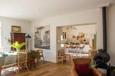 a living room and dining room with a table and chairs at La case d'Eyragues, au coeur des Alpilles in Eyragues