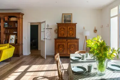 a living room with a table and a cabinet at La case d'Eyragues, au coeur des Alpilles in Eyragues