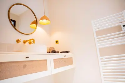 a bathroom with a sink and a mirror at Mas La Bergerie in Eygalières