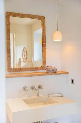 a bathroom with a sink and a mirror at Mas La Bergerie in Eygalières