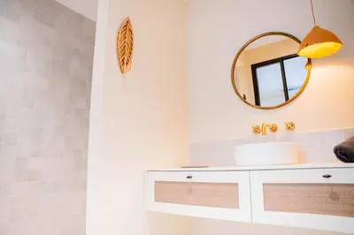 a bathroom with a sink and a mirror at Mas La Bergerie in Eygalières