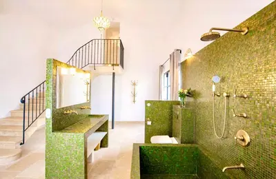 a bathroom with a shower with green tiles at La Grande Verrière - Luberon en Provence in Goult