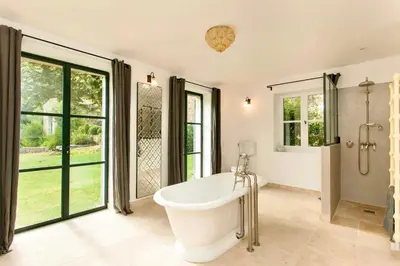 a large bathroom with a tub and a shower at La Grande Verrière - Luberon en Provence in Goult