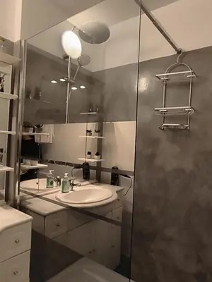 a bathroom with a sink and a shower at Grand appartement de charme calme et lumineux parking compris in Aix-en-Provence