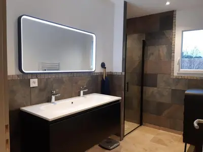 a bathroom with a sink and a shower at Villa les Romarins in Saint-Didier