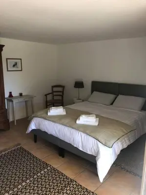 a bedroom with a bed with two towels on it at Le Jas Gabriel in Murs