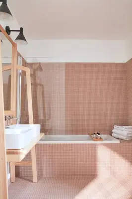 a bathroom with a tub and a sink at La Bastide du Mourre - Fontenille Collection in Oppède