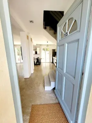 a door leading to a hallway with a living room at Maison de village 4 étoiles avec piscine privee in Villars