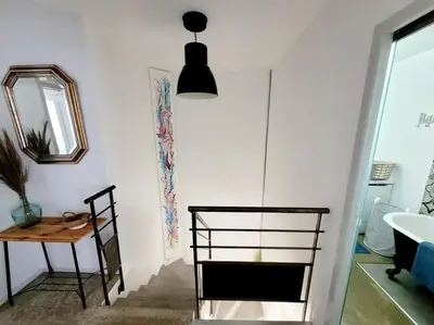 a room with a table and a chair and a mirror at Maison de village 4 étoiles avec piscine privee in Villars