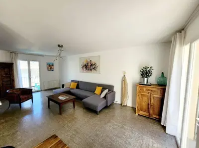 a living room with a couch and a table at Maison de village 4 étoiles avec piscine privee in Villars