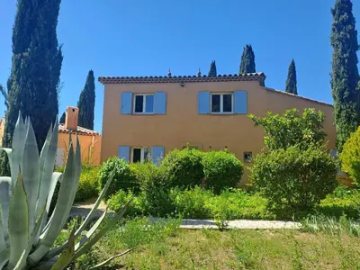 a large house with trees in front of it at Magnifique Villa avec piscine in Cadenet