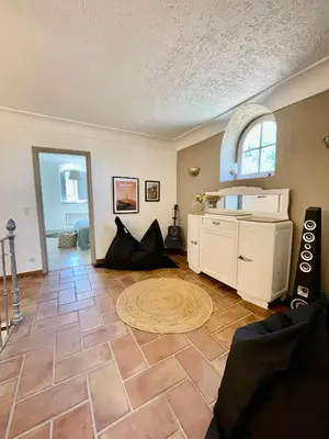 an empty living room with a large room with a floor at Notre Dame des Anges DUPLEX in Rustrel
