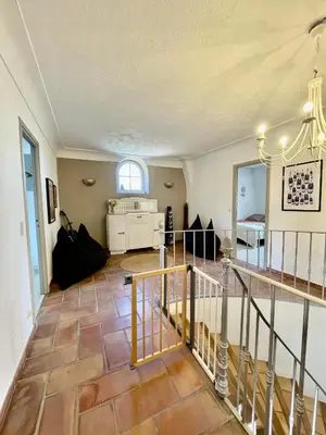 a large living room with a staircase and a room at Notre Dame des Anges DUPLEX in Rustrel