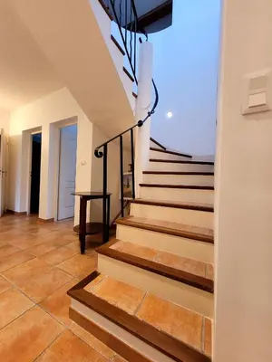 a staircase in a house with wooden floors at La Villa des Lavandes - A 300m du Centre, au calme, et au vert ! in LʼIsle-sur-la-Sorgue