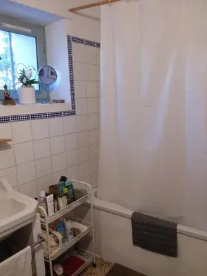 a bathroom with a shower and a sink and a tub at Chambre d'hôtes chez Gwennaelle in Bédoin