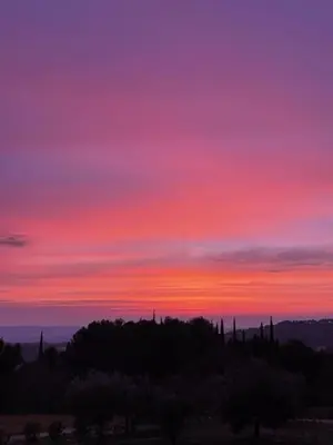 a sunset with a purple and red sky at Appartement entier Vue sur PAYS D Aix in Aix-en-Provence