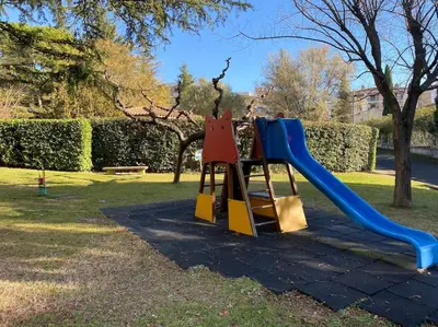 a playground with a slide in a park at Magnifique T3 rénové, 15min à pied CV, pkg privé in Aix-en-Provence