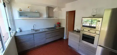 a kitchen with a sink and a stove at Joli apparemment Attention un dégât des eaux en plafonds des WC et salle de bain mais tout fonctionnelle in Salon-de-Provence