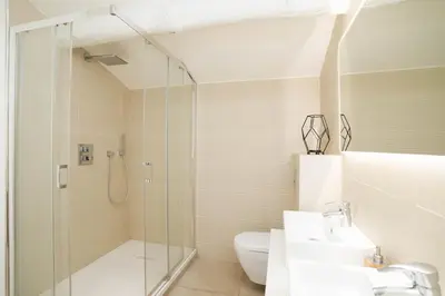 a bathroom with a shower and a toilet and a sink at Villa climatisée avec vue en pleine pinède aixoise in Saint-Marc-Jaumegarde