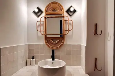 a bathroom with a sink and a mirror at Casëto Luberon in Apt