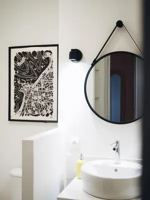 a bathroom with a sink and a mirror on the wall at Casëto Luberon in Apt