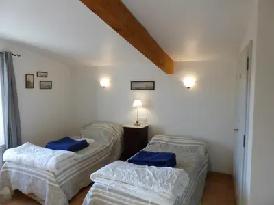 a room with two beds with blue pillows in it at Luberon - Mas du Grand Saint Julien in Rustrel