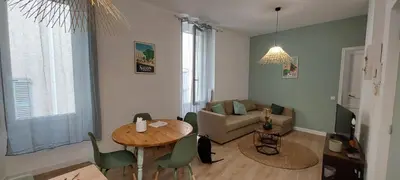 a kitchen with a counter and a stove top oven at La PAUSE Salonaise 