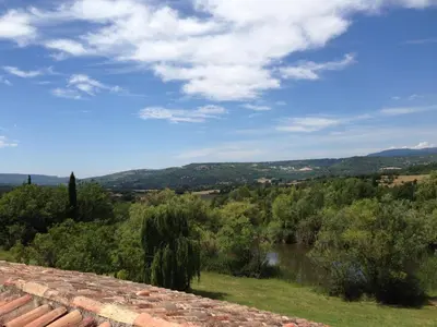 a view of a river from a stone wall at La Grande Bouisse gites avec piscine dans le Luberon, Provence in Céreste
