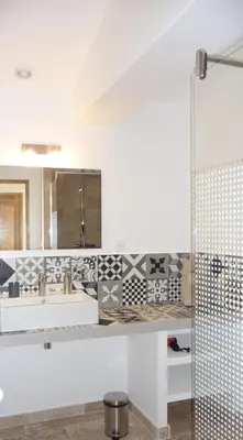 a bathroom with a tub and a sink and a mirror at La Grande Bouisse gites avec piscine dans le Luberon, Provence in Céreste
