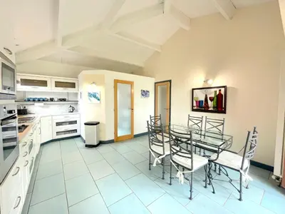 a kitchen with a glass table and chairs at Petite Toscane Villa close to Aix en Provence in Ventabren