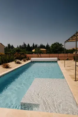 a swimming pool in the middle of a yard at Villa Moka - private pool in Saumane-de-Vaucluse