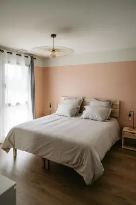 a bedroom with a large bed with white pillows at Villa Moka - private pool in Saumane-de-Vaucluse