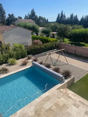 a swimming pool in the yard of a house at Villa Moka - private pool in Saumane-de-Vaucluse