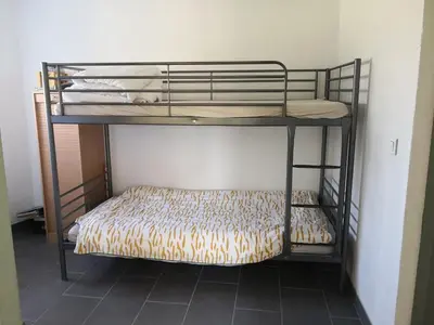 a couple of bunk beds in a room at Mas Paolo Gite de charme en Provence Piscine in Le Thor