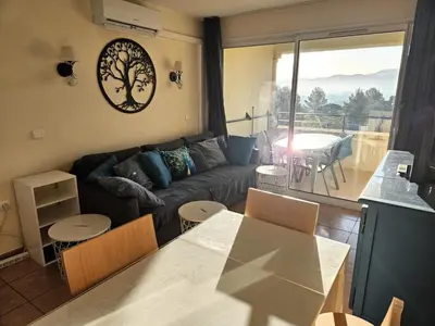 a living room with a couch and a table at Village Pont Royal en Provence - maeva Home - Appartement climatisé 3 pièces 4 personnes - Prestige - super Home MAE-7124 in Mallemort