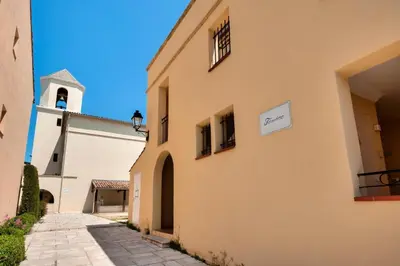 a church with a sign on the side of a building at Village Pont Royal en Provence - maeva Home - Appartement climatisé 3 pièces 4 personnes - Prestige - super Home MAE-7124 in Mallemort