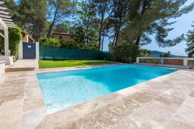 a swimming pool in the backyard of a house at Villa Les Cigales Velaux in Velaux
