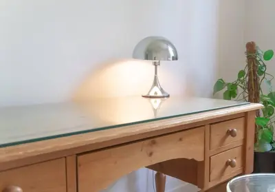 a desk with a lamp on top of it at Spacieux T3 * centre ville * sans vis à vis in Aix-en-Provence