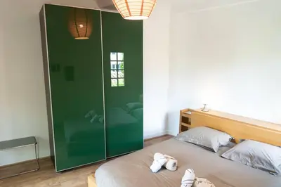 a bedroom with a bed with two white towels on it at Spacieux T3 * centre ville * sans vis à vis in Aix-en-Provence