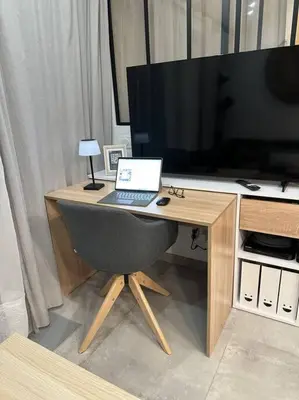 a computer desk with a laptop and a television at Cocon Classé 3 Etoiles - Love et Détente - SPA in Carpentras