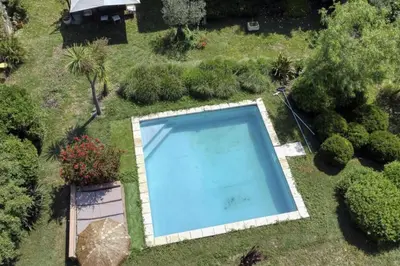 an overhead view of a swimming pool in a garden at Vent de Bohème in Cabannes