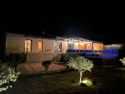 a house lit up at night with lights at Gite La Madeleine du Luberon. in Lioux